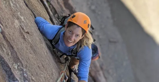 A rock climber on the Bastille Crack in Eldorado Canyon State Park Colorado