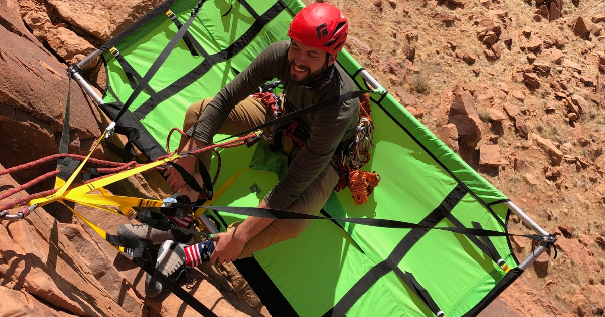 A student in the bigwall climbing course learning how to set up a portaledge in moab utah