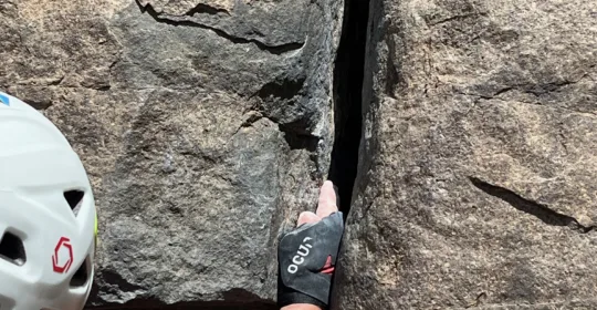 Crack climbing student practicing handjams in Golden Colorado