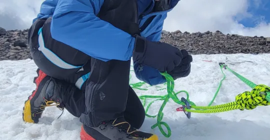 A crevasse rescue student practicing hauling systems in Colorado