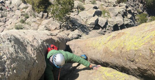 A rock climber on the Durrance route on Devils Tower Wyoming