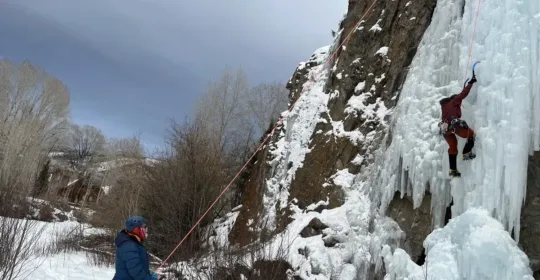 Ice climbers in the Lake City ice park climbing steep ice