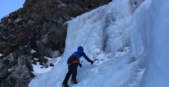 An ice climbing student learning how to ice climb at Lincoln Falls Colorado