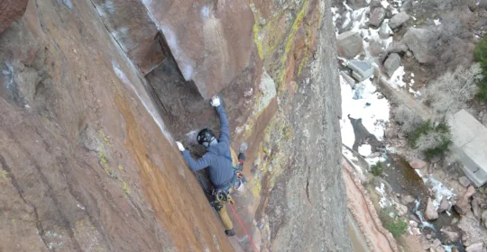 A climber on pitch three of Outer Space in Eldorado Canyon State Park Colorado