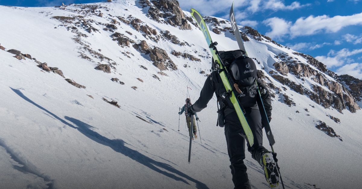 A backcountry skiier booting up steeper terrain in Colorado
