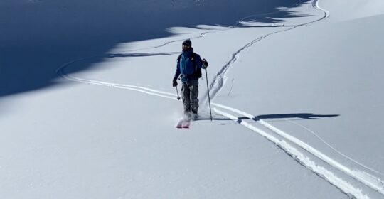 A skier on a privately guided backcountry ski touring day in Colorado
