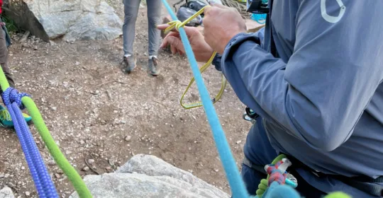 Guide demonstrating rock rescue in Colorado