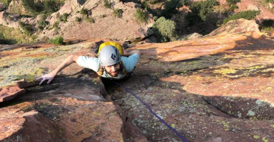 A rock climber on the classic route Ruper in Boulder Colorado