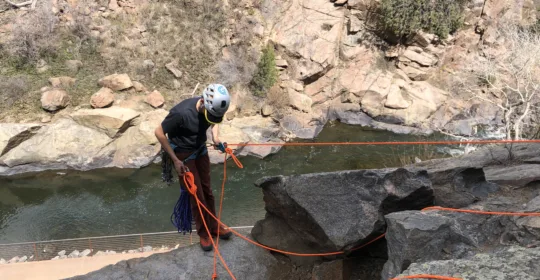 SPI course student setting up a base managed anchor in Golden Colorado