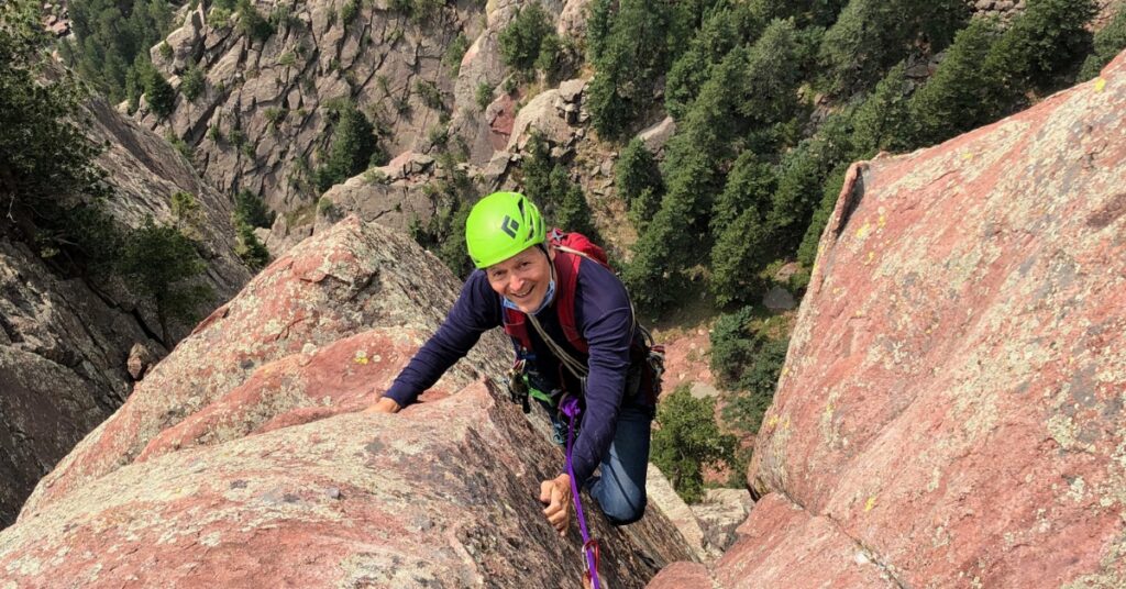 A rock climber on Swanson Arete in Eldorado Canyon State Park Colorado