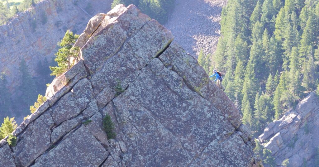 A climber on the last pitch of the Yellow Spur in Boulder Colorado