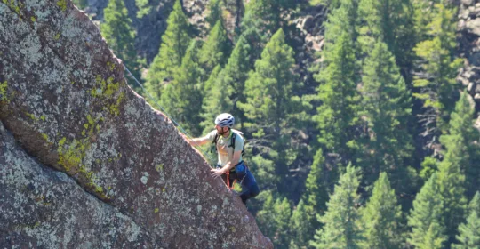 A climber in Eldorado Canyon State Park on the Yellow Spur