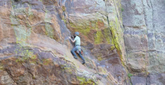 A climber on pitch two of the Yellow Spur in Boulder Colorado
