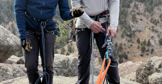 An SPI candidate practicing a belayed rappel