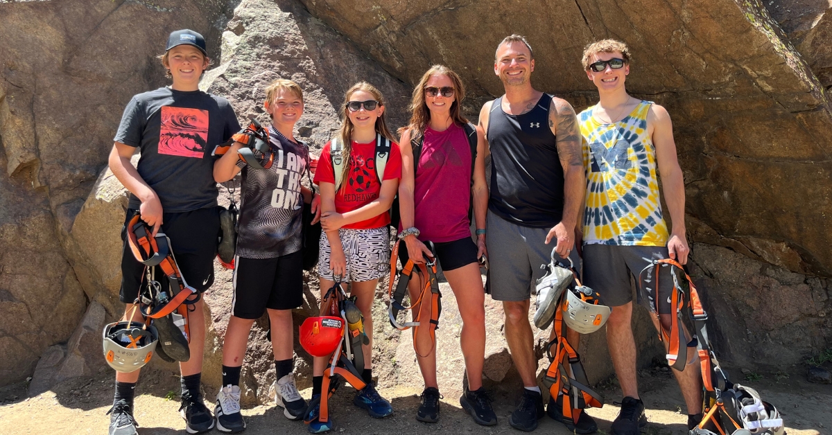 Beginner rock climbers learning from a guide in Golden Colorado