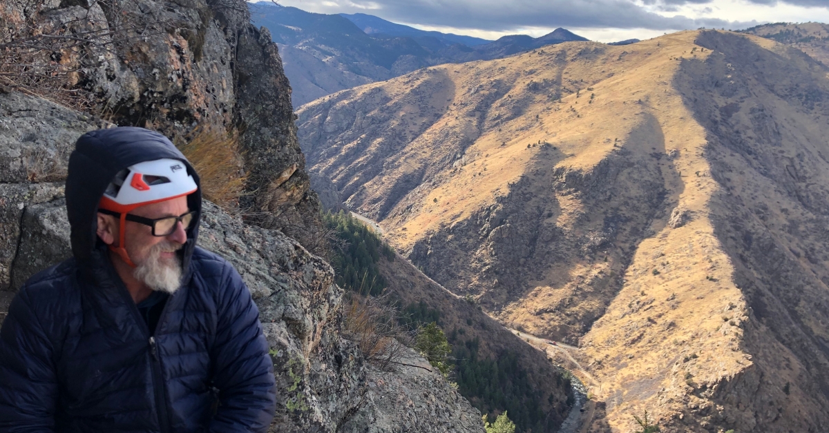 A rock climber looks back on the views in Clear Creek Canyon during the winter in Golden Colorado