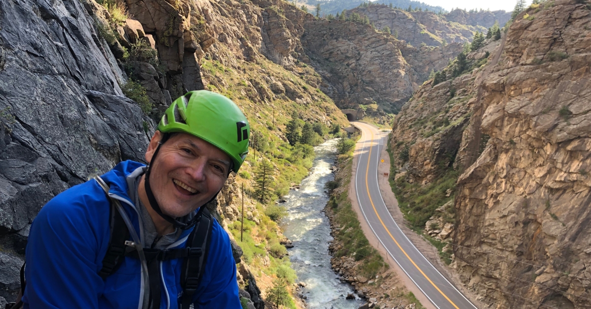 A rock climber enjoying the views on Playin Hooky in Clear Creek Canyon outside Golden Colorado