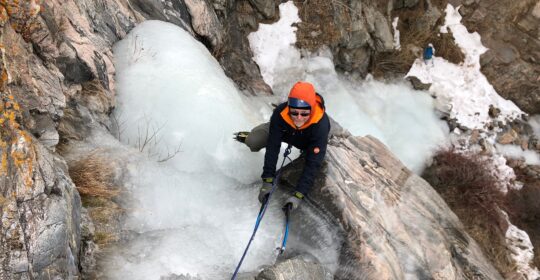 Privately guided ice climbing student climbing in Clear Creek Canyon Colorado