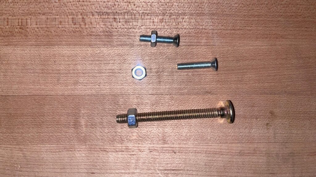 Through bolts and nuts in a backcountry ski repair kit