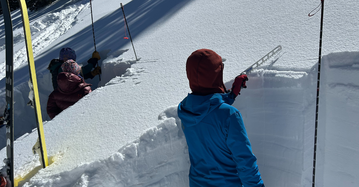 A skier on a AIARE 2 + Rescue Course snow analysis.