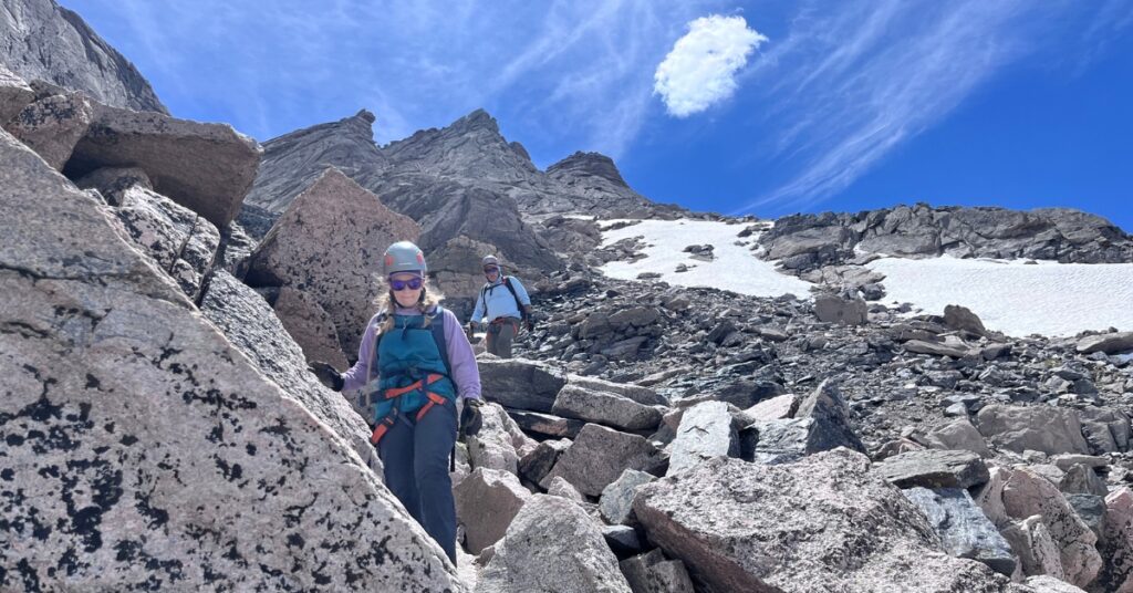 Two climbers descending the Trough on Longs Peak Keyhole Route